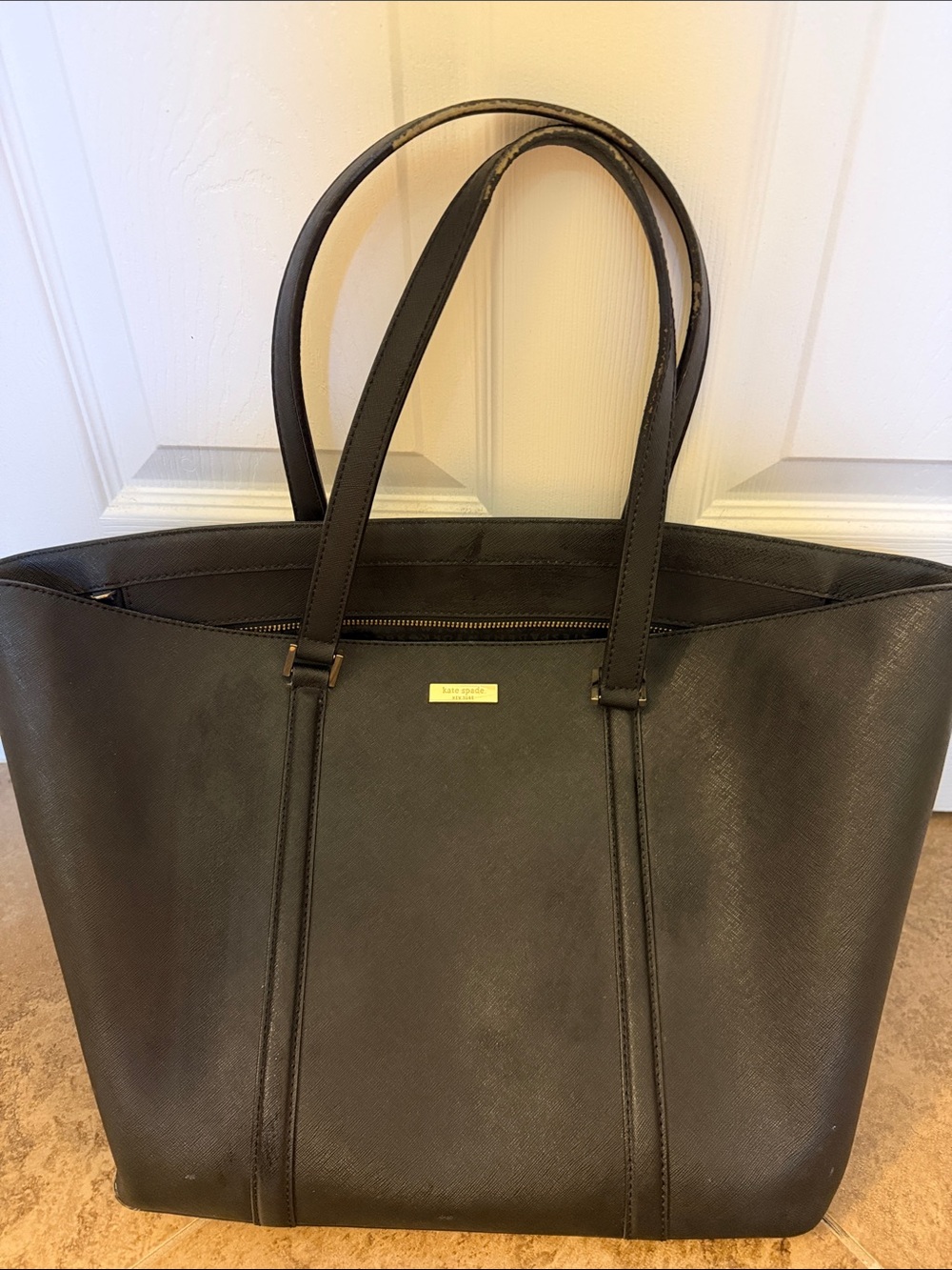 kate spade black leather tote with gold-tone logo